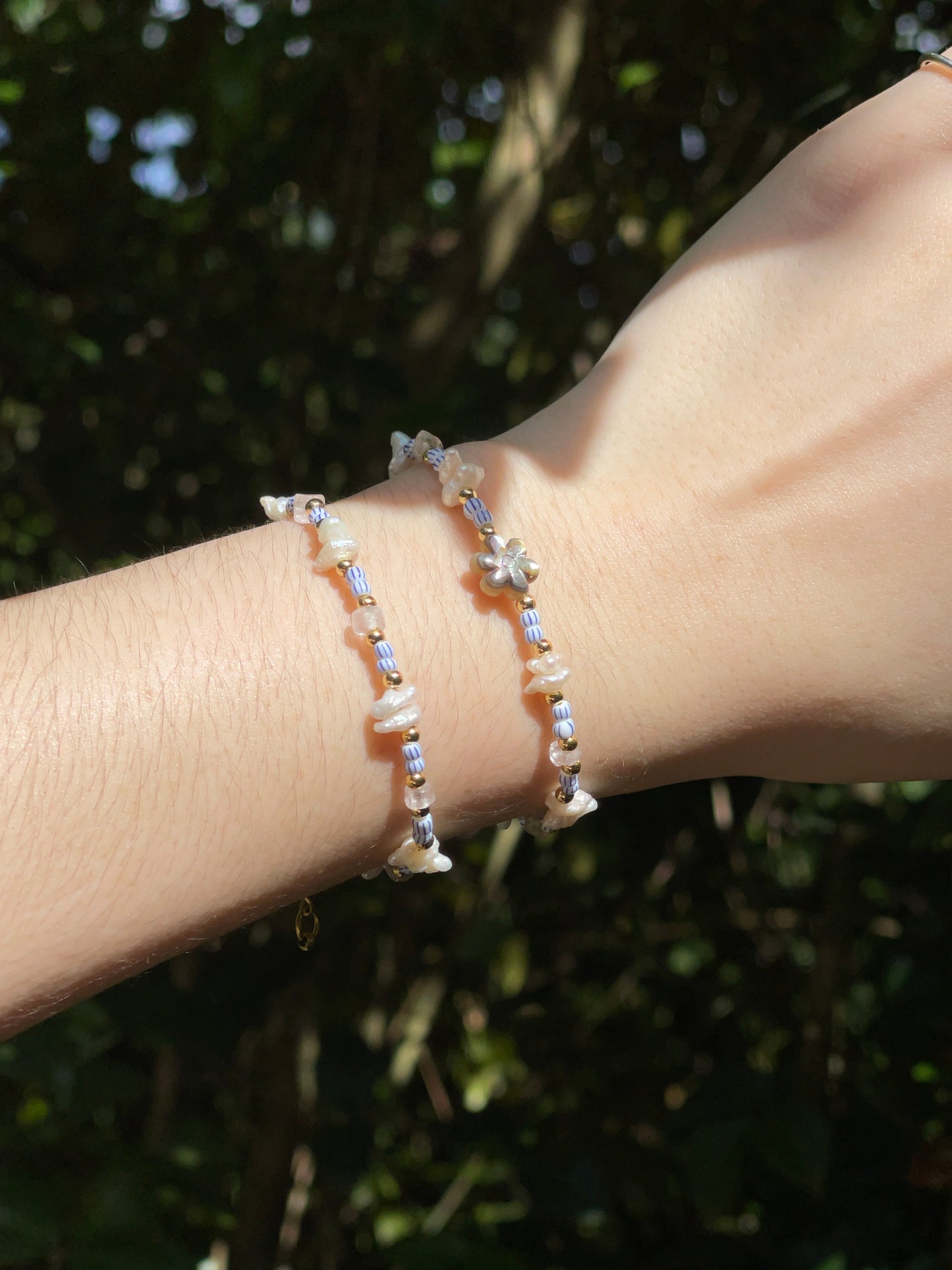 Blue/white and pearl beaded Bracelet (left)