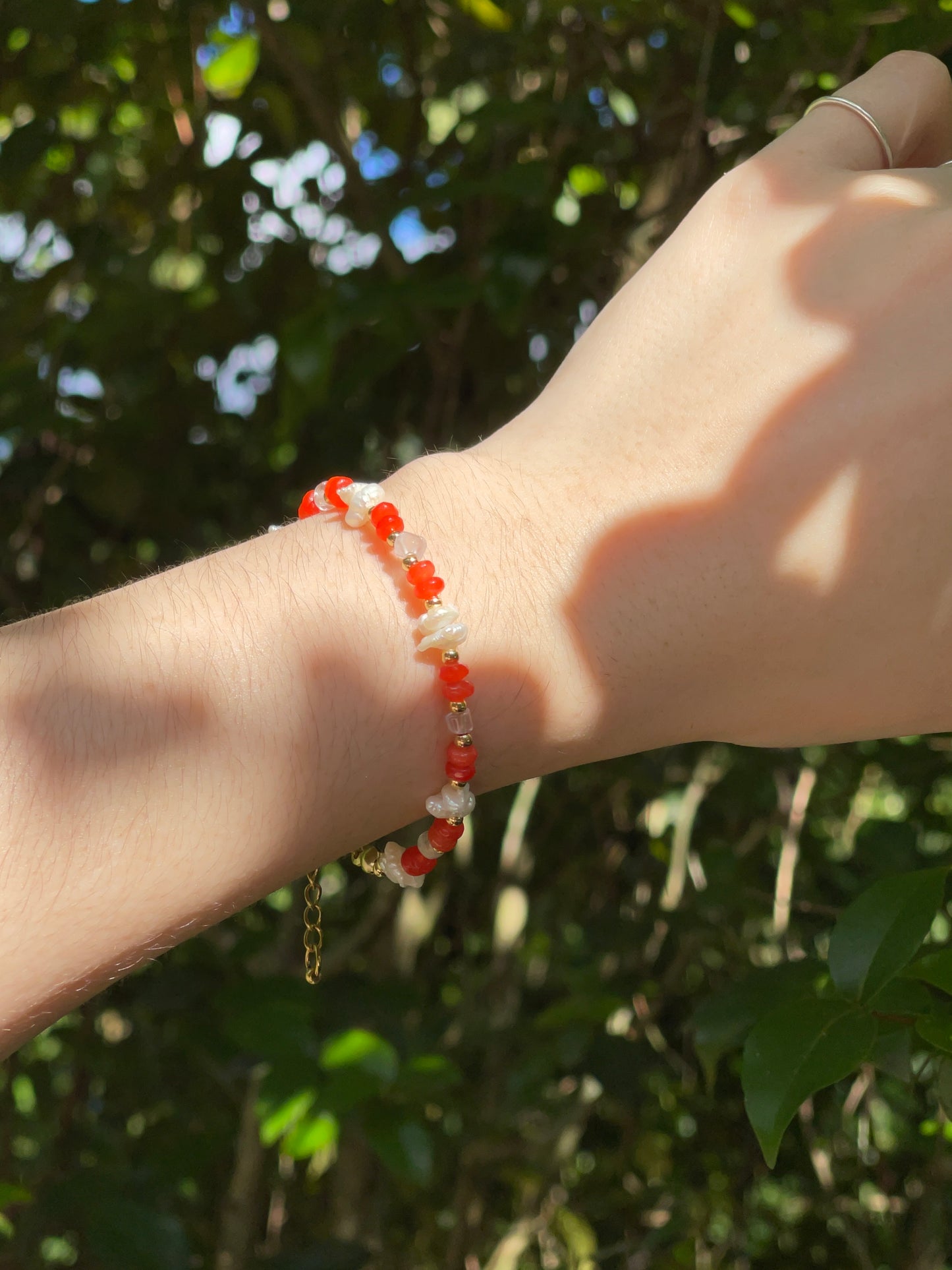 Orange bead and pearl bracelet