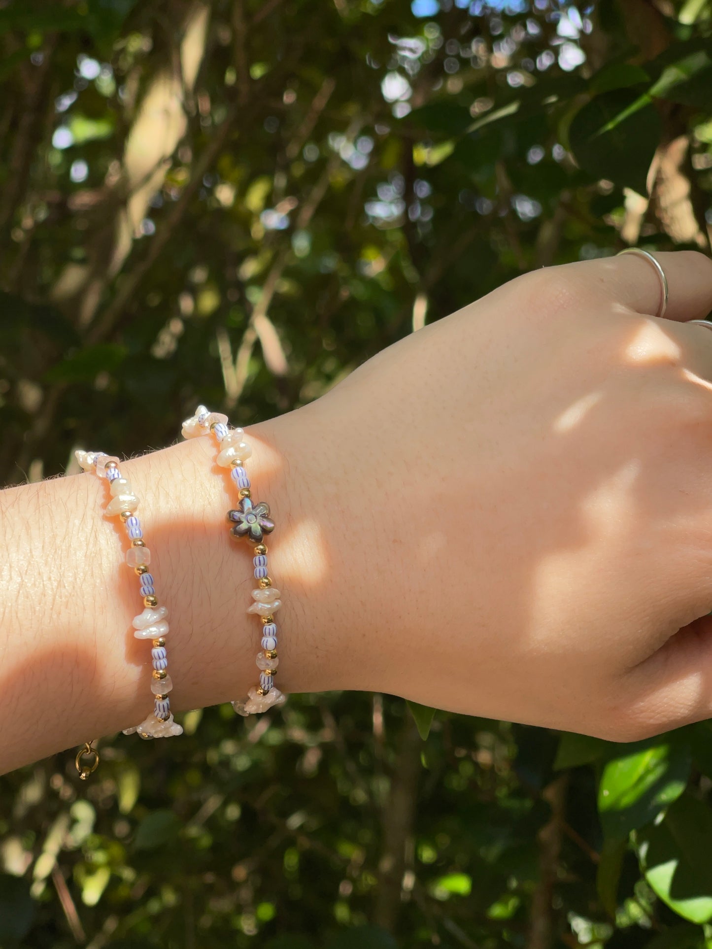 Blue/white and pearl beaded Bracelet (left)