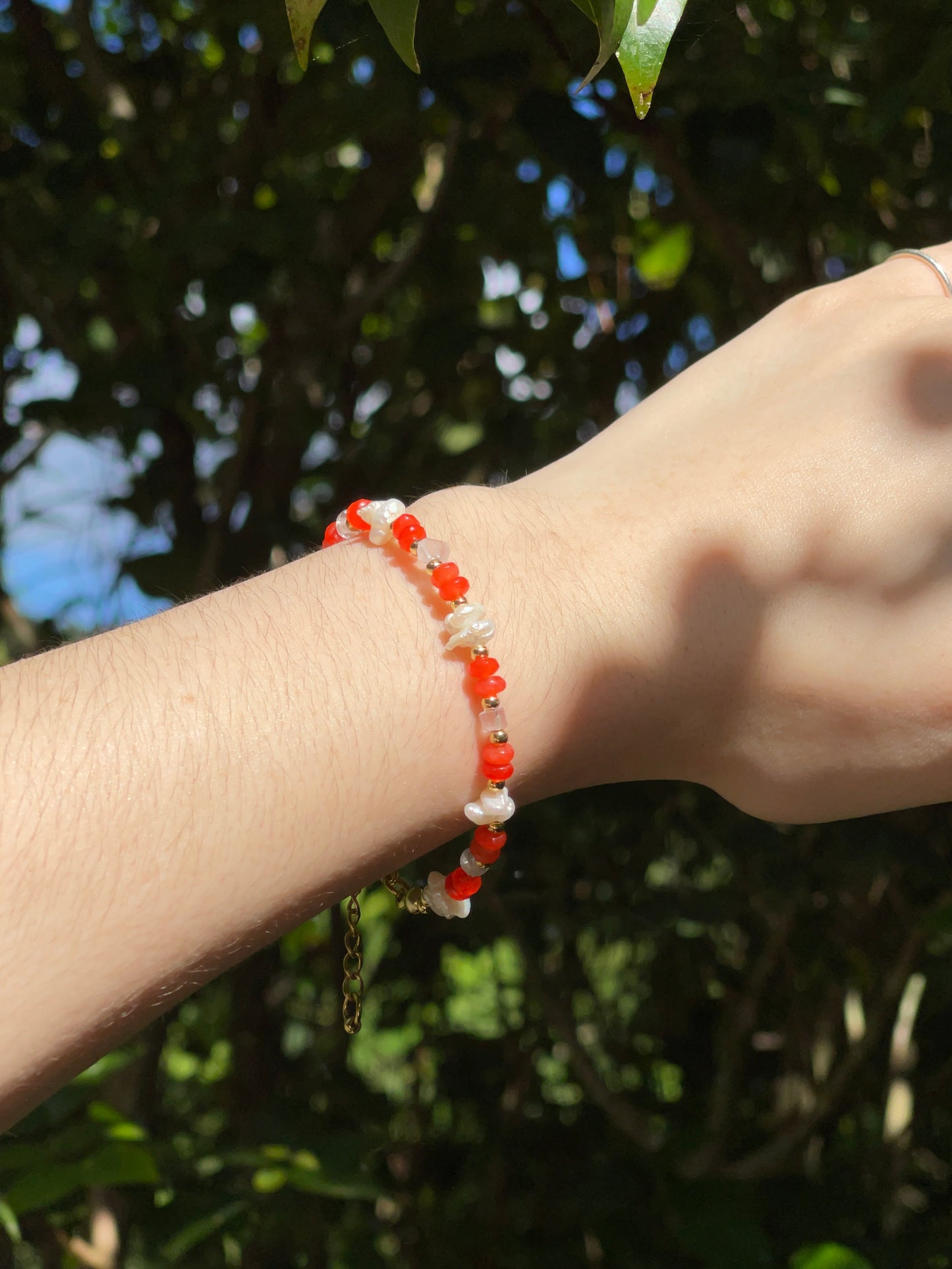 Orange bead and pearl bracelet